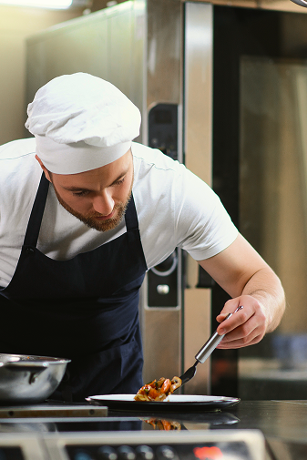 chef-of-a-big-restaurant-prepares-dishes-modern-k-2026-03-24-05-56-05-utc 1