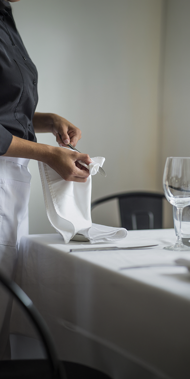 waitress-setting-table-in-restaurant-2026-03-25-05-06-04-utc 1